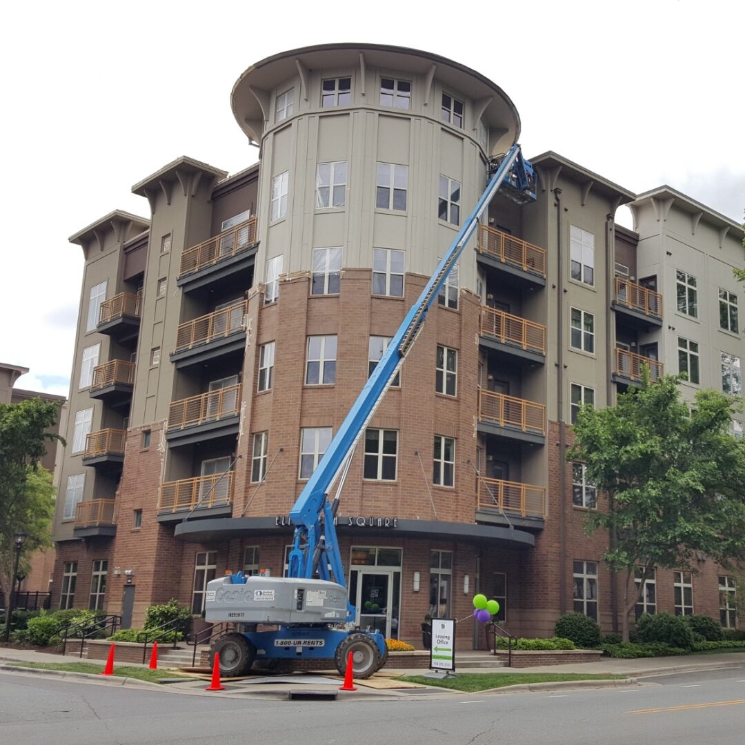 commercial building construction with cherry picker
